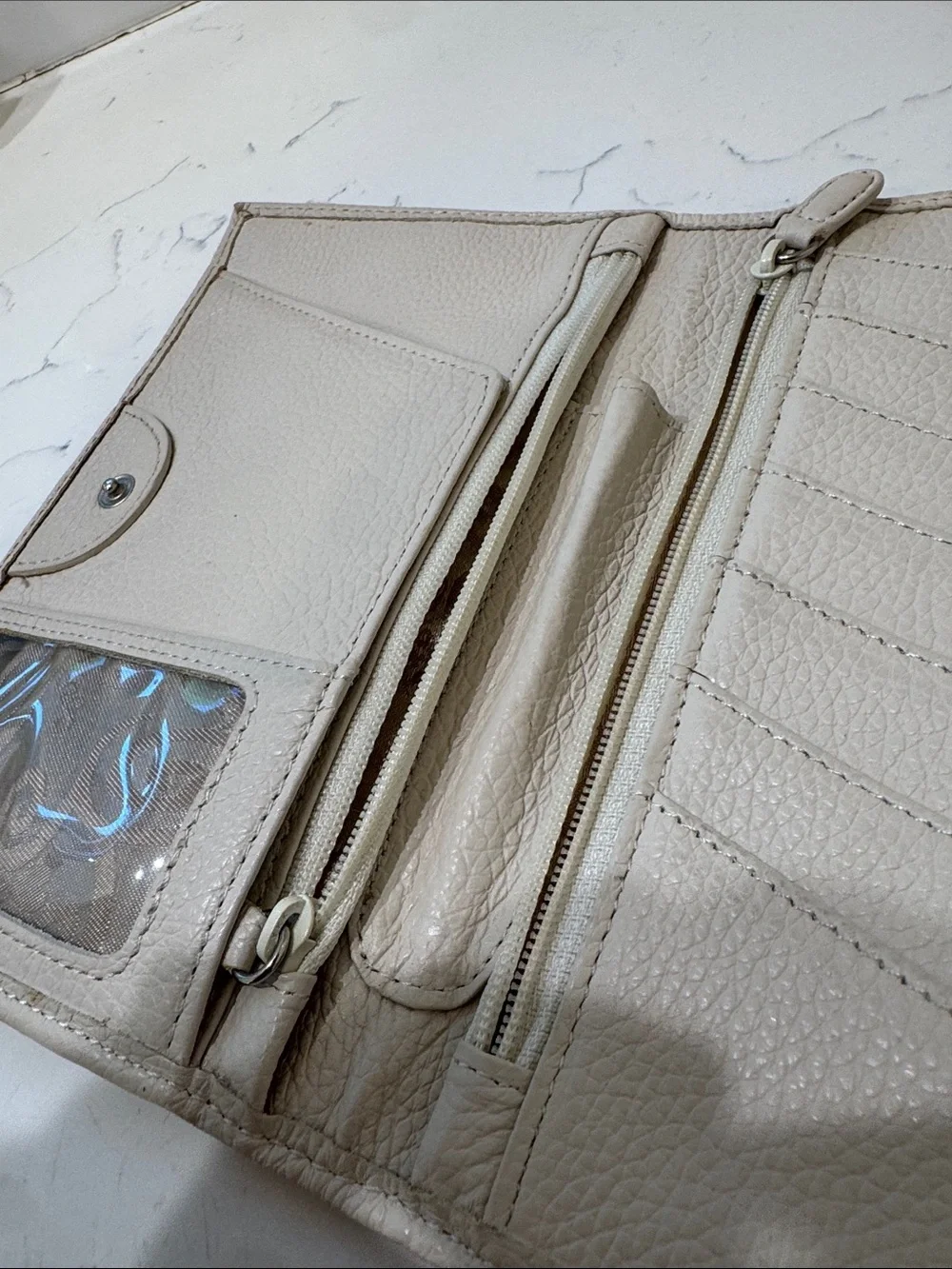 Brighton Cream Pebbled Leather Ferrara Fold Wallet with Embossed Medallion